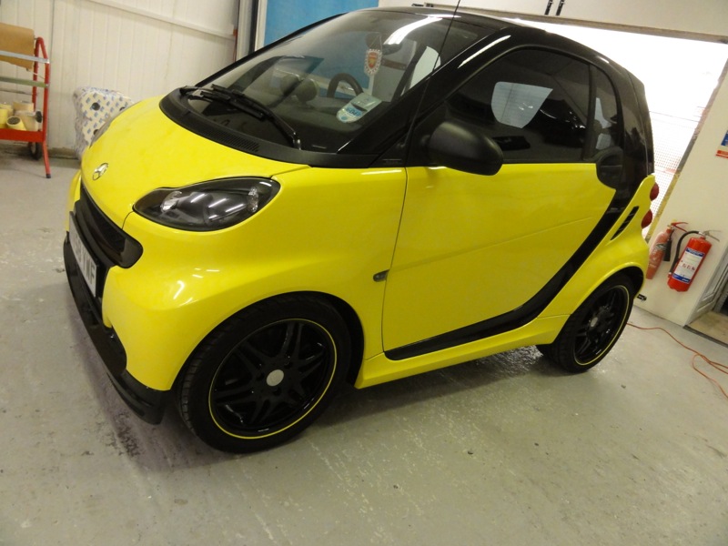 Black and Yellow Smart after Alloy Black Wheels and Vinyl Wrap